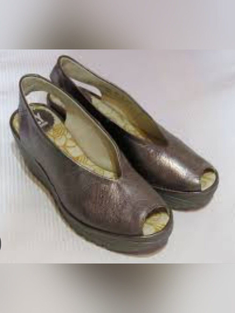 Fly London Yeay Peep Toe Sandal is a modern, comfort-focused platform wedge